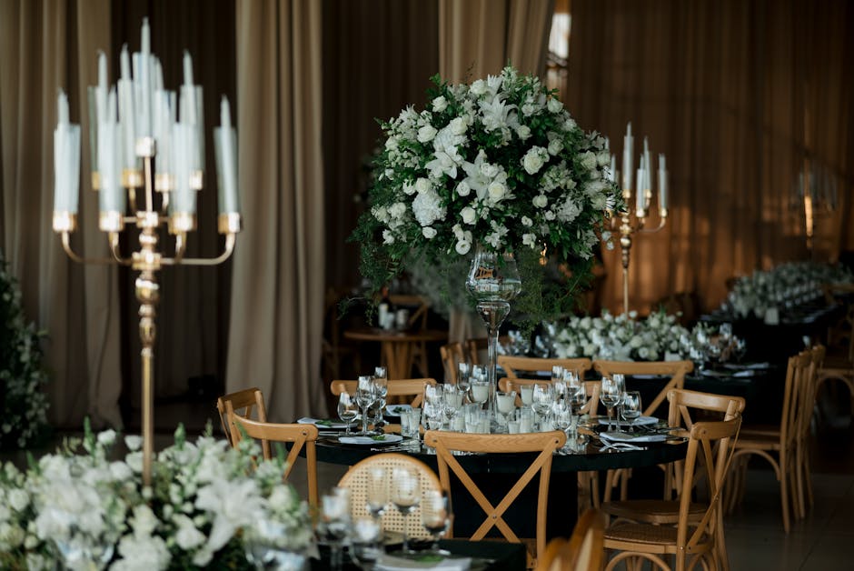 Elegant wedding reception setting with floral arrangements
